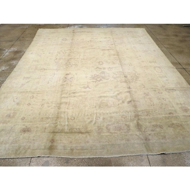 An antique Turkish Oushak large room size carpet handmade during the Early 20th century. Measures: 12' 1" x 15' 6"