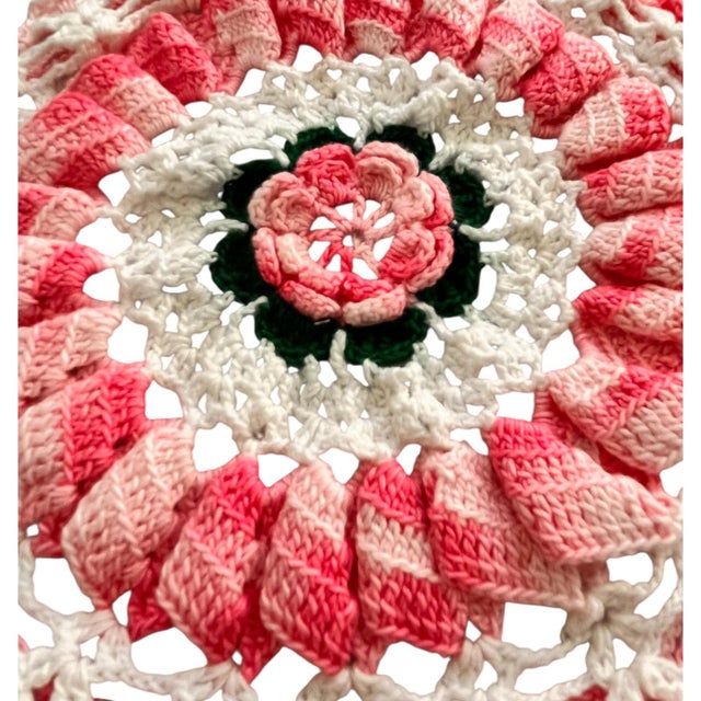 Beautiful handmade, crochet doily with a 3D design. It has a 3D flower in the center, a petal trim in the center, and a...