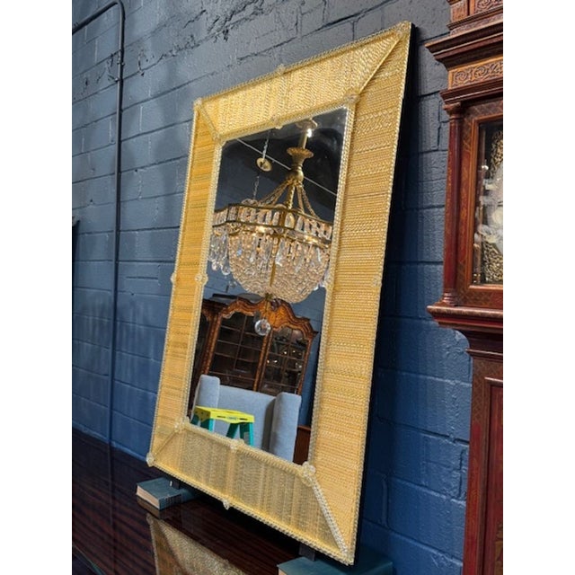 Beautiful light gold Murano glass mirror with twist rods. Featuring shimmering textural glass. Makes a gorgeous focal...
