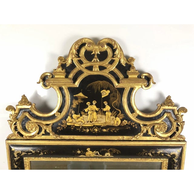 A large, exceptional and gorgeous 20th century intricately-carved and hand-painted chinoiserie gilt wood mirror with...