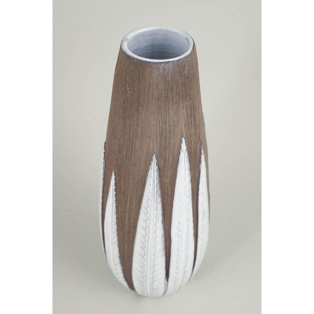 Anna-Lisa Thomson for Upsala Ekeby, Paprika vase. Elegant stoneware vase with characteristic relief decoration inspired by...