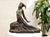 An elegant Art Deco bronze sculpture depicting Clara, a graceful dancer design attributed to Dimitri Chiparus. The figure...