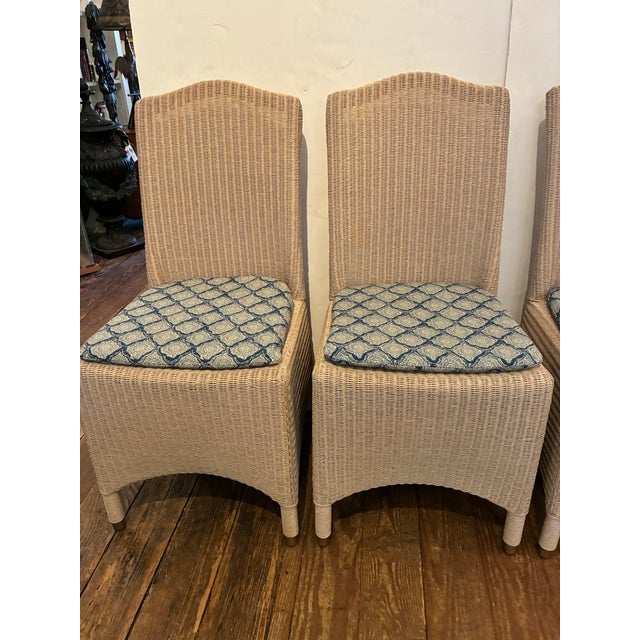 Set of four (4) great looking Lloyd Loom woven dining chairs with new custom Kravet printed batik seat pads. Lloyd Loom...
