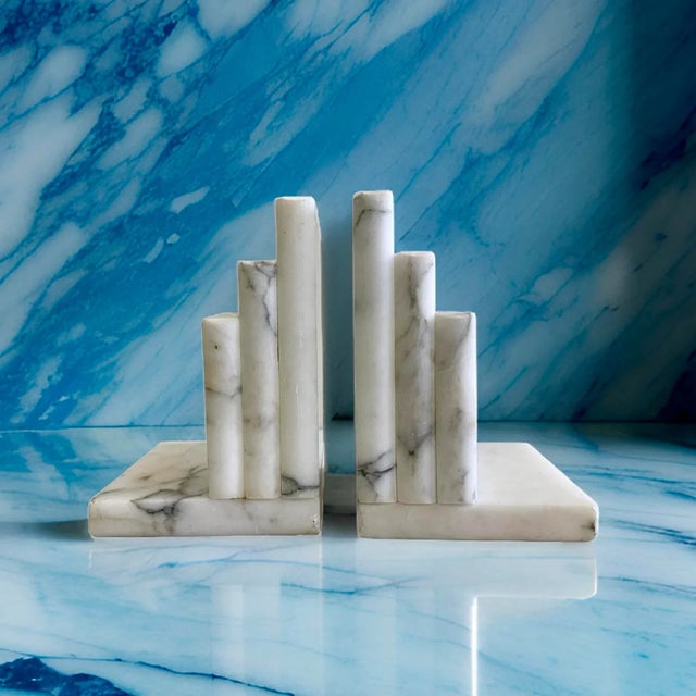 A fine and unique pair of matching Italian grand tour bookends made from carved Italian Carrara marble- in very good...