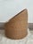 Embrace a sophisticated blend of organic texture and tailored luxury with this striking vintage wicker barrel chair....