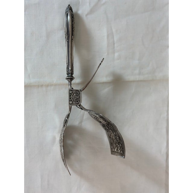 Elegant silver-plated asparagus tongs dating from the early 20th century, combining refinement and functionality. This...