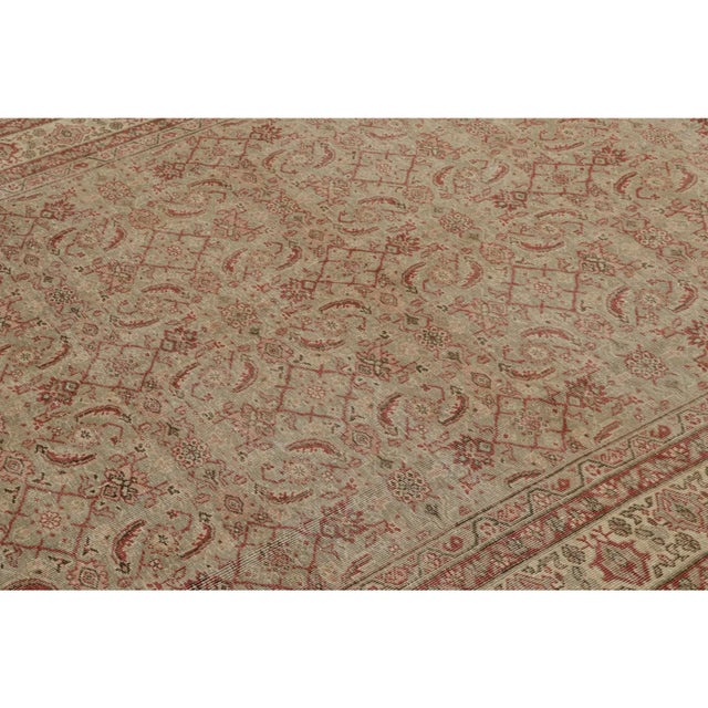 Hand-knotted in wool, this vintage 6x10 Turkish rug features a play of floral patterns in the field and border alike. On...