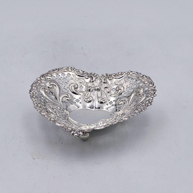 A sterling heart-shaped dish, marked "Gorham / Sterling", U.S.A. circa 1930.