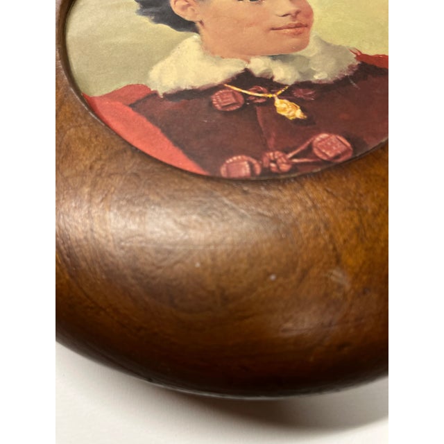 Antique wooden hat form made into a frame for a picture of a woman. Keep that image in or change it to your tastes. Hanger...