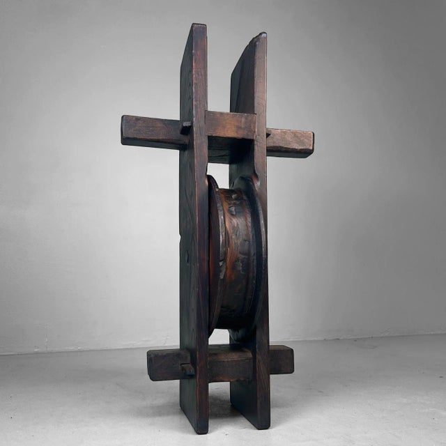 A striking and sculptural object, originally used as a pulley system for drawing water from wells or for hoisting heavy...