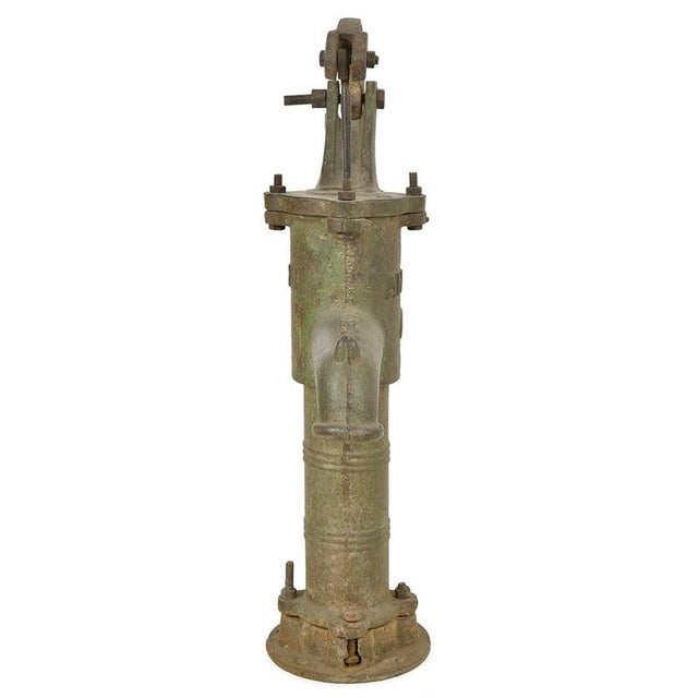 Combining robustness and functional elegance, this cast iron hand water pump embodies the authentic charm of old-fashioned...
