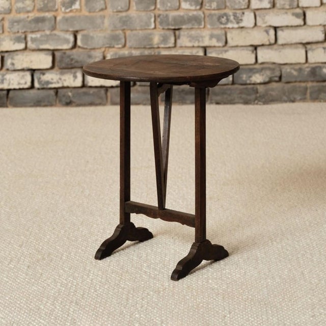 This 19th century French oak table de vin is a charming and versatile antique, crafted from solid oak with a beautifully...