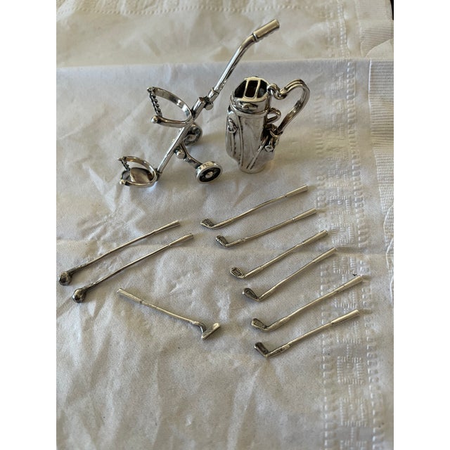 I inherited this Tiffany sterling silver mini golf set from my mother, who was the golfer. I can remember it being a big...