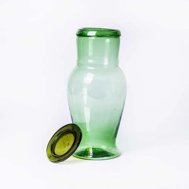 Contemporary Moroccan Mouth Blown Glass Jar – Green. Hand-made in Morocco. The glass is mouth blown and available in an...