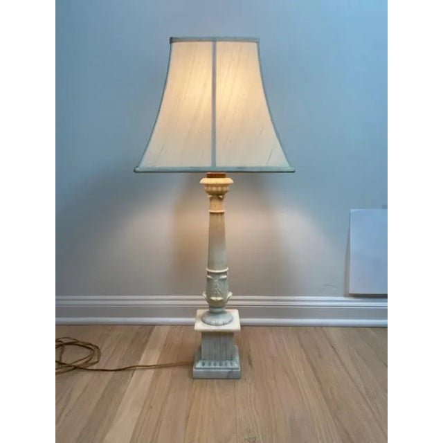 Antique carved marble column lamp. Originally acquired from an upscale estate in New York. Estimated to be from 1920's or...