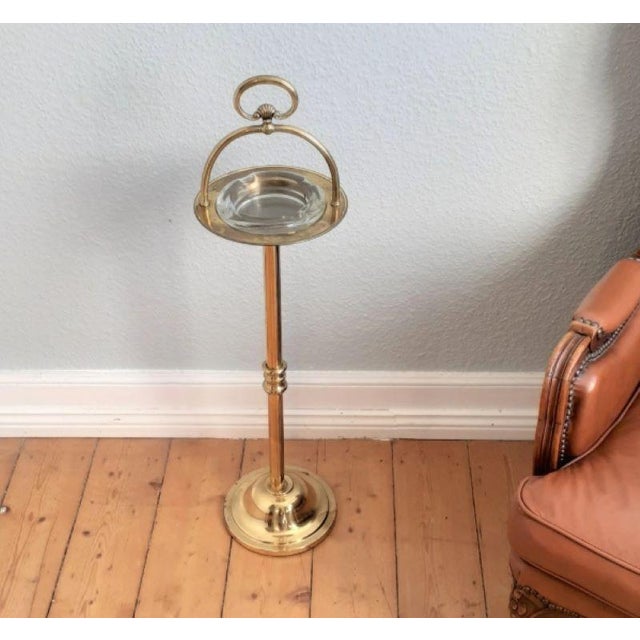 A beautifully decorated, light-colored, solid, vintage brass plant stand that complements almost any setting. The ashtray...