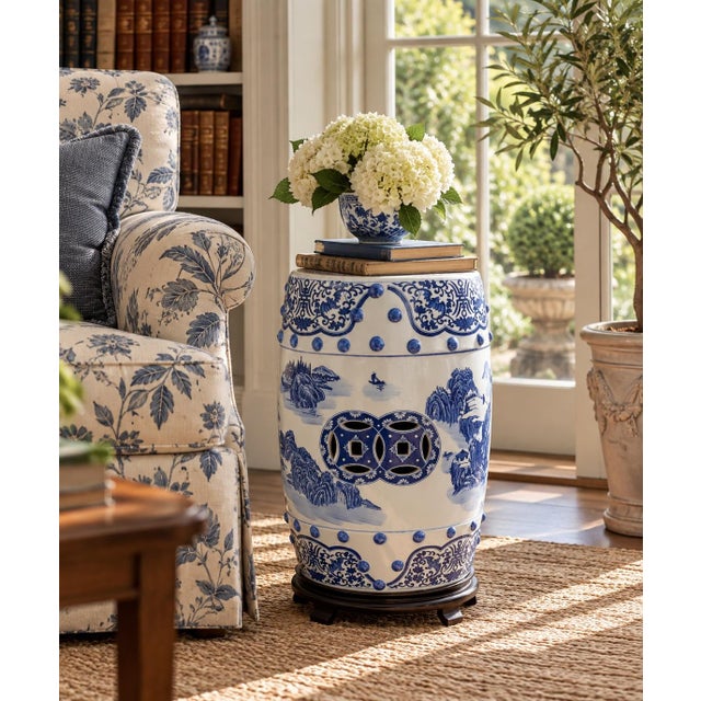 A classic blue and white porcelain garden stool, decorated with traditional Chinese motifs and stylized floral elements....