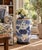 A classic blue and white porcelain garden stool, decorated with traditional Chinese motifs and stylized floral elements....