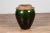 A Chinese contemporary green glazed water jug with unusual design and calligraphy. Born in China, this handsome pottery...