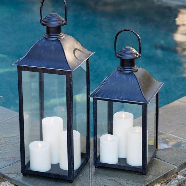 Designed with a wide square base, this lantern can easily house multiple candles. The washed black finish and oversized...