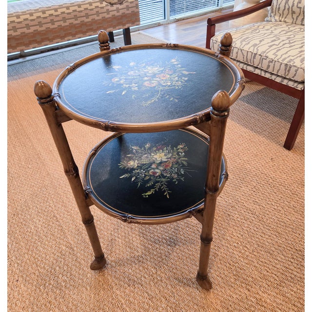 A beautiful two tiered bamboo folding accent table. The trays are removable, and the base folds flat. The trays are done...