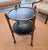 A beautiful two tiered bamboo folding accent table. The trays are removable, and the base folds flat. The trays are done...