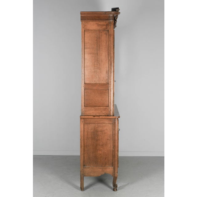 A 19th century French buffet à deux corps from the town of Caux in Normandy, made of solid oak with raised panels and...