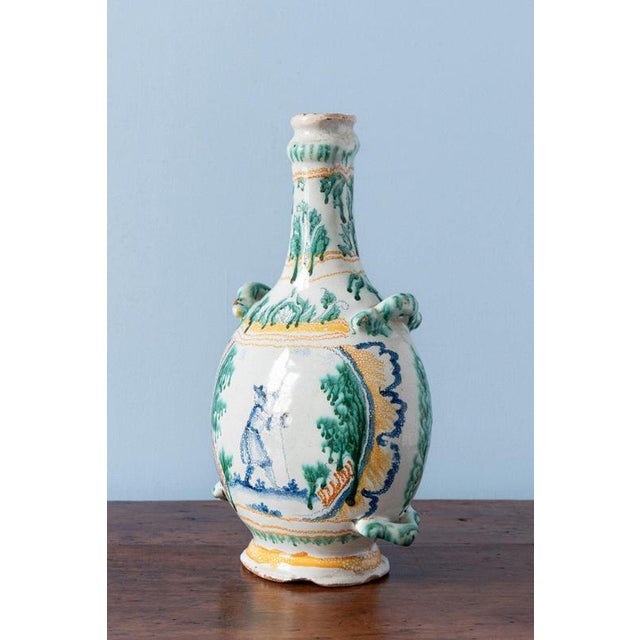 Height: 30 cm Width: 17 cm Depth: 11 cm Two losses to foot. Slight wear throughout, commensurate with age.