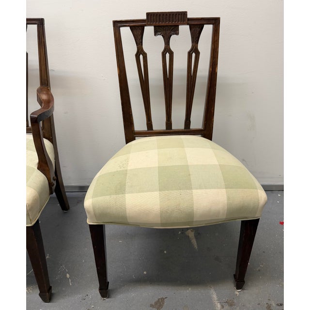 This beautiful set of six (6) antique George III Hepplewhite upholstered dining chairs (two armchairs and four side...