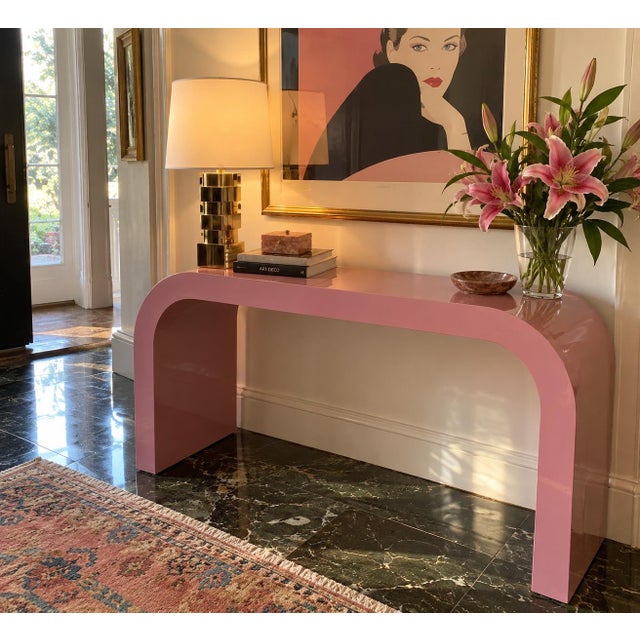 White areas are glare from overhead lighting This mauve Postmodern waterfall console brings an instant hit of polished...