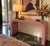 White areas are glare from overhead lighting This mauve Postmodern waterfall console brings an instant hit of polished...