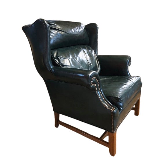 The Smith & Gaines Leather Nailhead Wingback Chair is a medium wood accent chair with a contemporary/modern style. This...