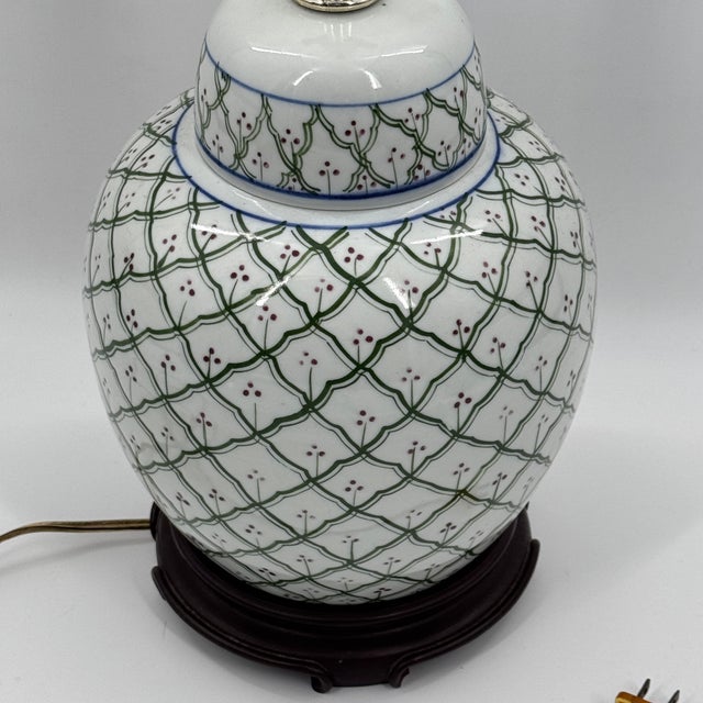 Beautiful vintage porcelain ginger jar lamp with hand-painted green trellis lattice and red floral dot motif. Mounted on a...