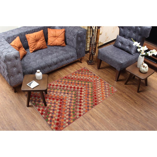 This stunning hand-knotted Afghan Balouchi rug is a captivating addition to any decor. Crafted by skilled artisans, it...