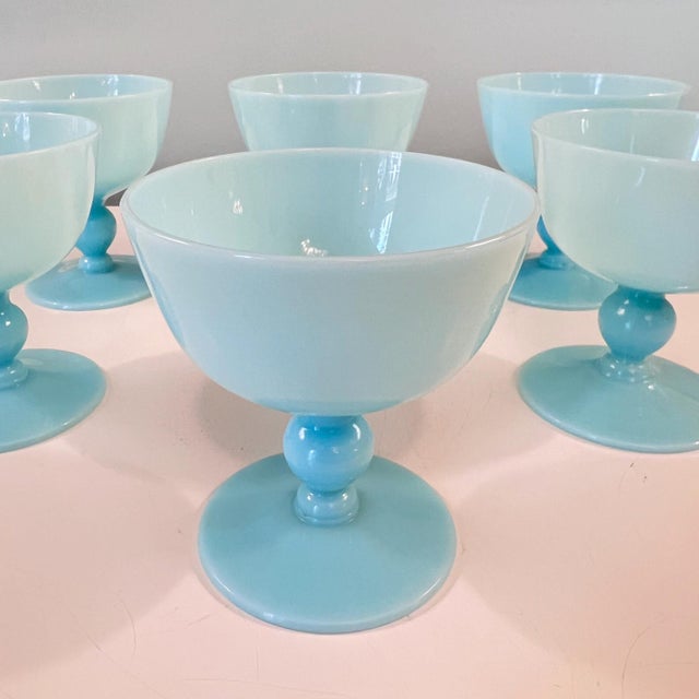 This is a beautiful set 6 of blue opaline champagne coupe glasses; 5 are in mint condition, one has a darker...