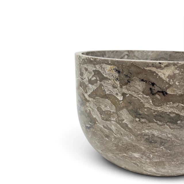 Elevate your indoor garden with the quiet luxury of natural stone. This planter is handcrafted from genuine onyx, a...