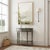 This elegant Butler Specialty Company demilune console table combines classic charm with a sleek, modern finish, making it...