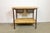 Vintage Industrial worktable from the 1960s. It features a brown iron construction, two wooden plates and two iron...