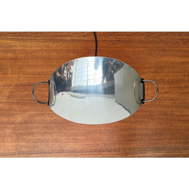 Rare table lamp by the Italian manufacturer Arteluce. A design in a postmodern style. Delicate brackets support a finely...