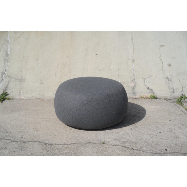 Sleek and modern ottoman pouf by Arper. Clean lines and firm, but generous foam padding. Works at both seating, or could...