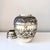 Vintage silver-plated brass lidded vessel featuring an intricate allover floral repoussé design. The beautifully detailed...