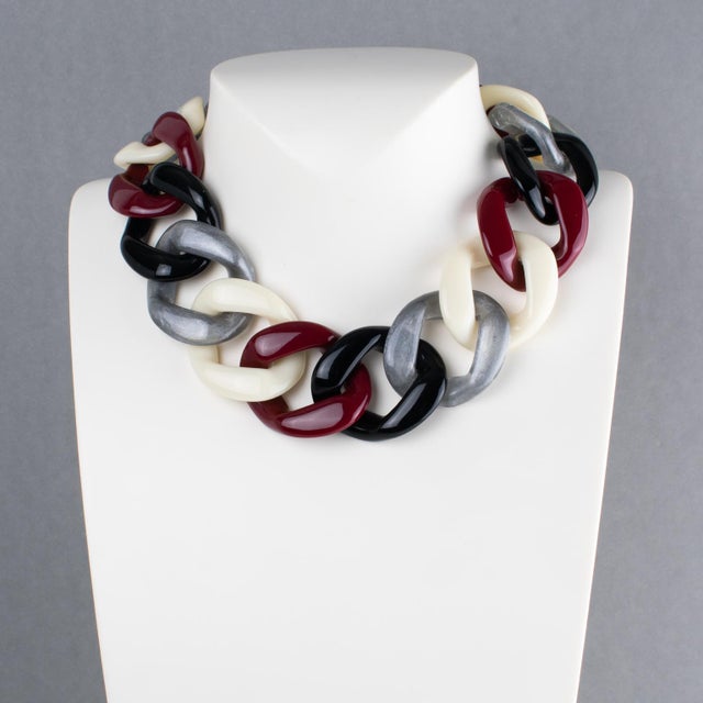 This stunning Angela Caputi, made-in-Italy, choker necklace features an extra-large flat resin chain in burgundy red,...