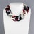 This stunning Angela Caputi, made-in-Italy, choker necklace features an extra-large flat resin chain in burgundy red,...