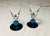 Two cordial fluted glasses with cobalt blue ball stems and base clear flutes