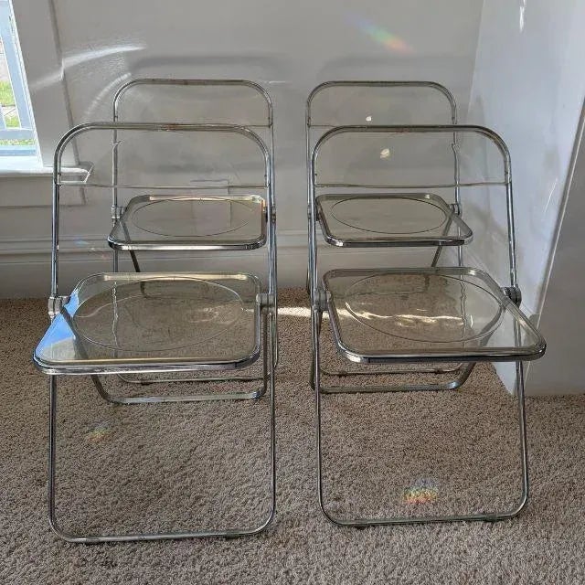 An iconic example of Italian modernism, this set of four (4) original Plia folding chairs was designed by Giancarlo...