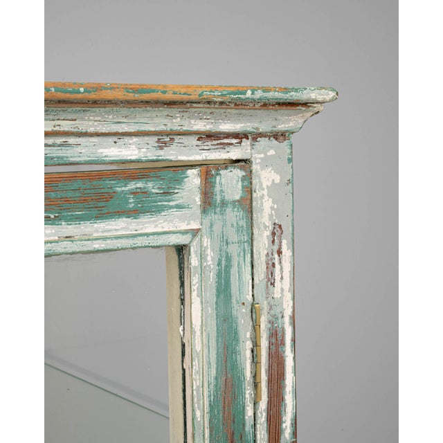 Step back in time with this charming 1900s French Wood White Patinated Small Vitrine, an enchanting piece that tells a...