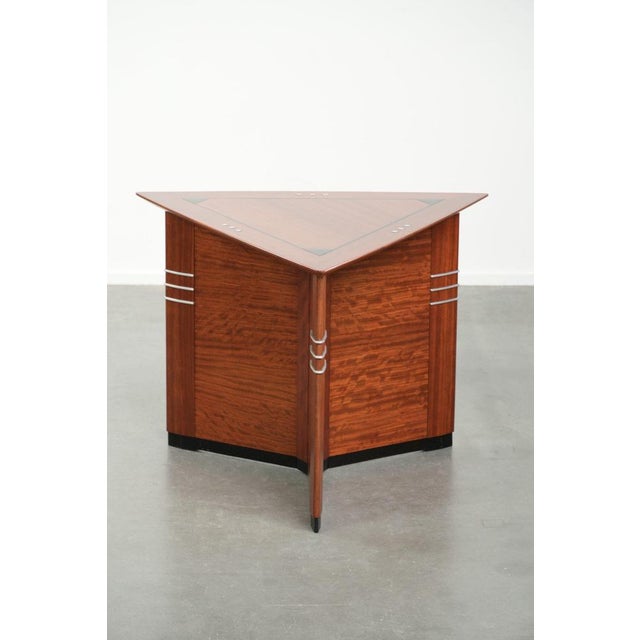This luxurious design side/coffee table by Schuitema from the Decoforma series features a unique triangular shape and is...