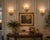 A striking and increasingly hard-to-find set of three vintage wall sconces featuring sculptural shield-form shades hand-...