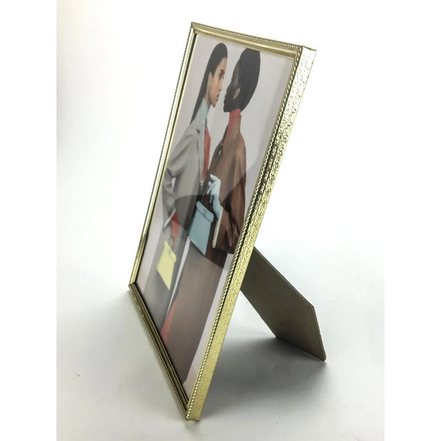 Traditional metal brass and glass frame to display your favorite 8 x 10 photo. In wonderful condition with minimal aging.