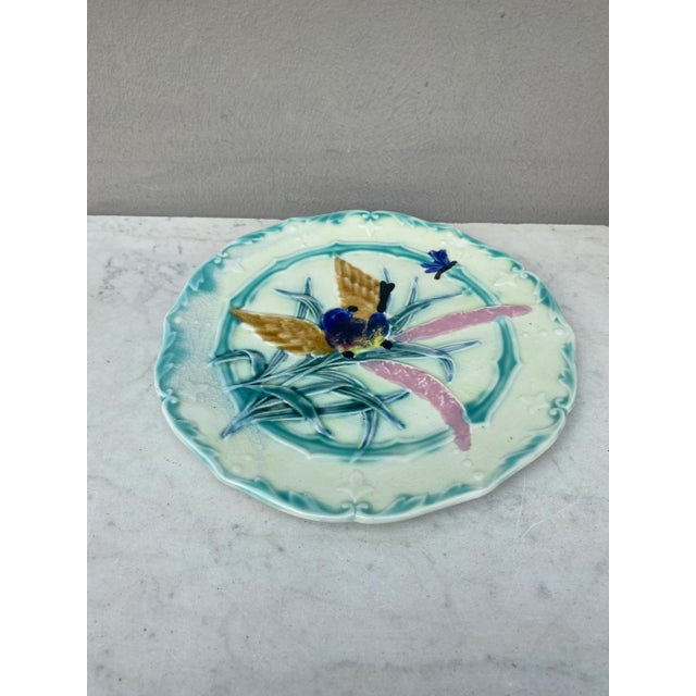 Lovely Majolica plate with bird and insect, leaves signed Saint Amand, circa 1890.